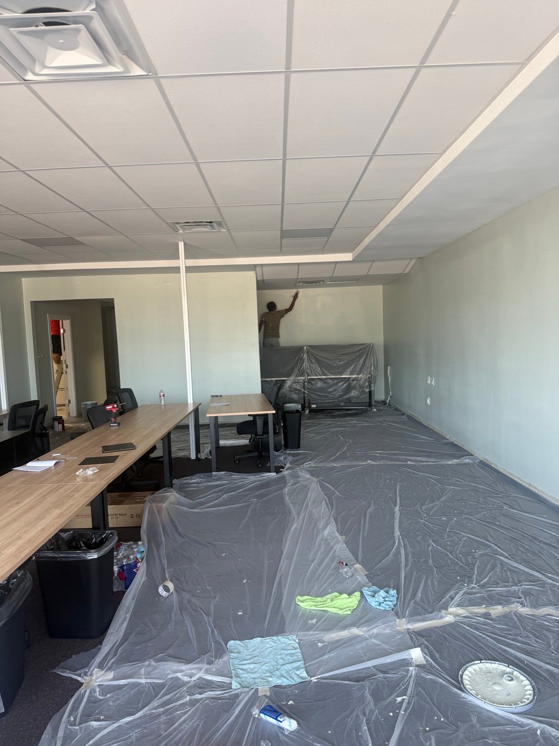Our team painting a commercial interior wall