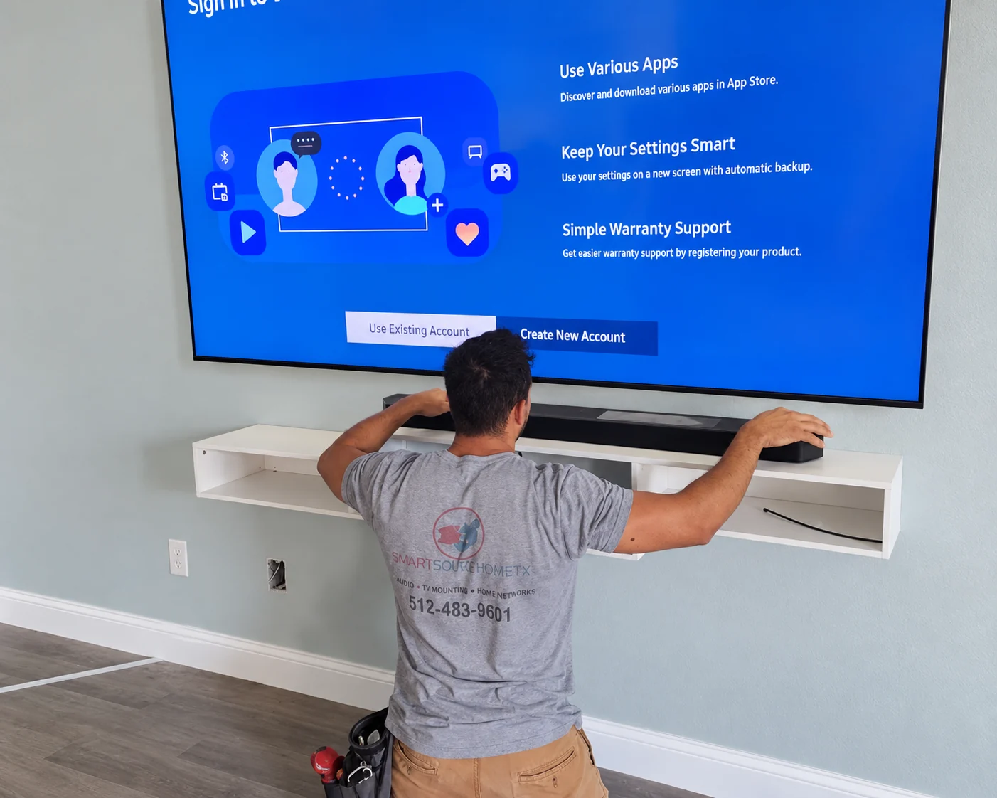 TV mounting technician completing a professional installation in Central Texas