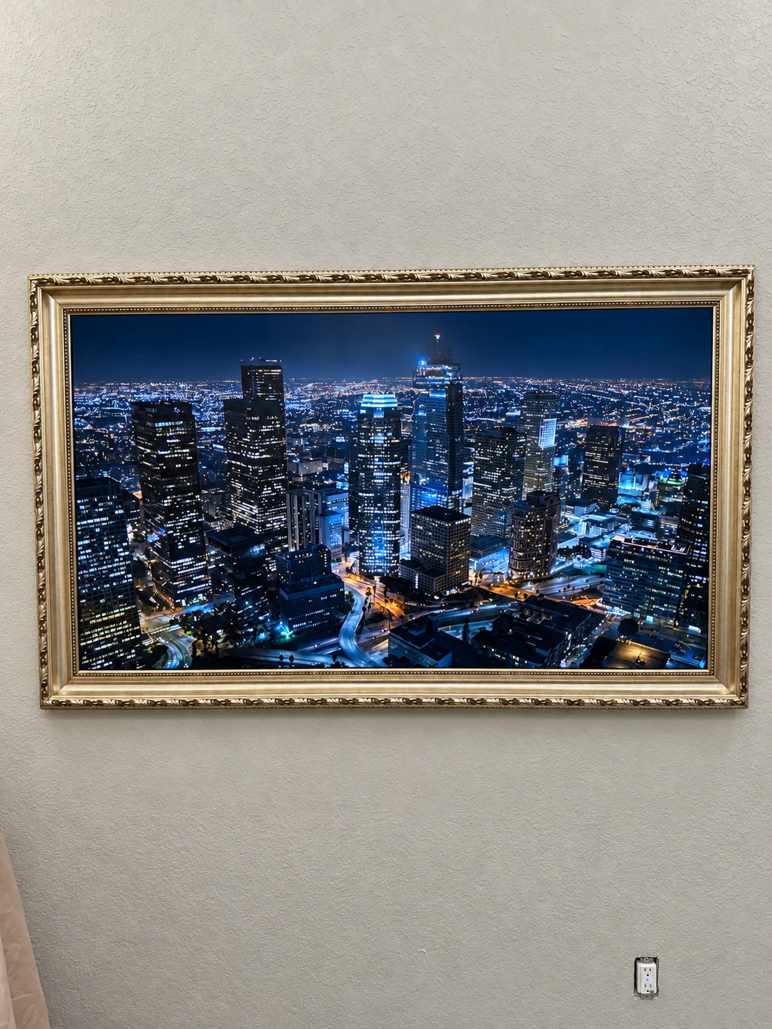 Samsung Frame TV mounted with a decorative gold frame in Central Texas